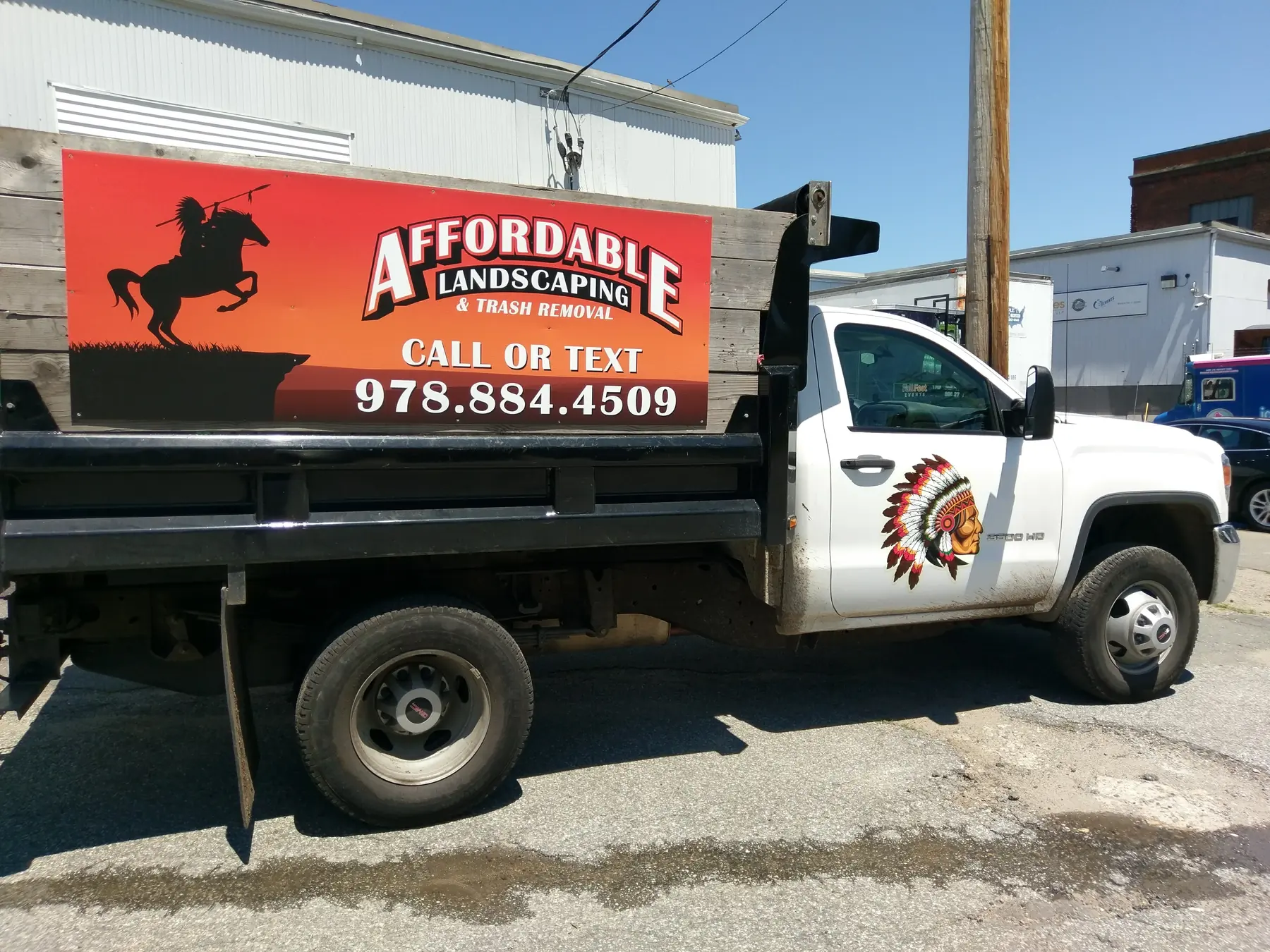 Affordable Landscaping dump truck with bold commercial graphics